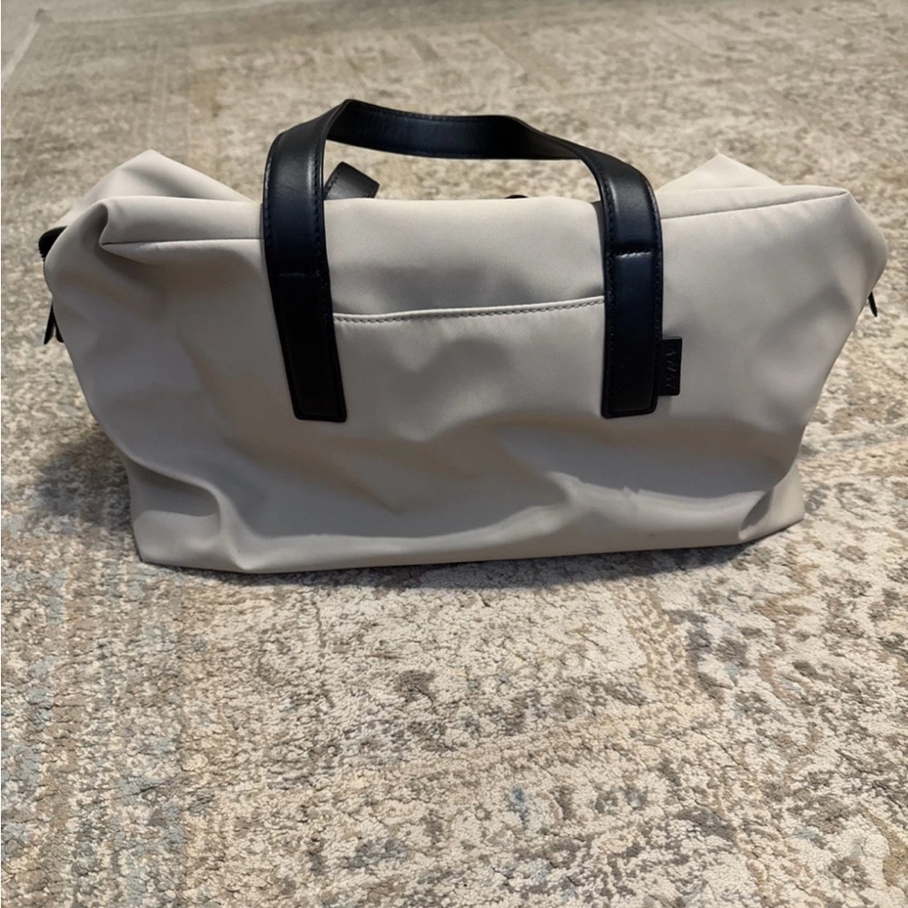 Away Beige Duffel Bag with Black Handles